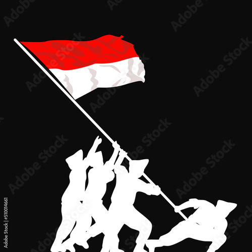 silhouette of soldier raising indonesian flag photo