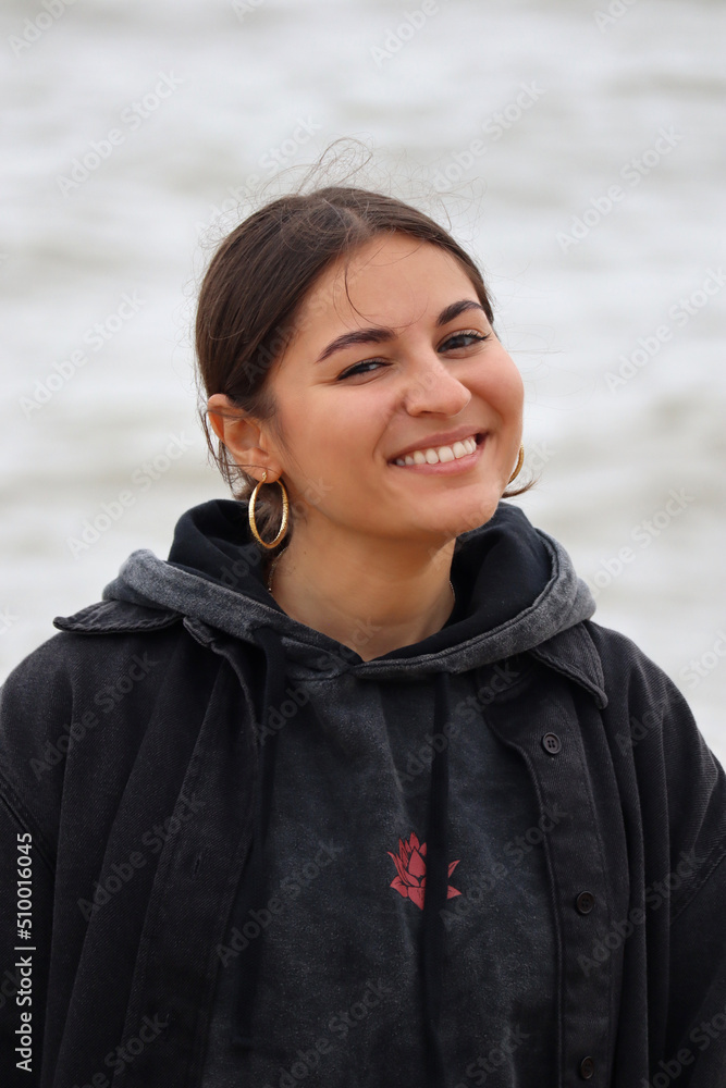 Beautiful young girl on the beach near the sea Beautiful young girl on the beach near the sea