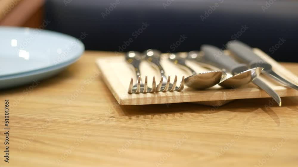 cutlery on plate on wooden background close up cutlery on plate on wooden background close up