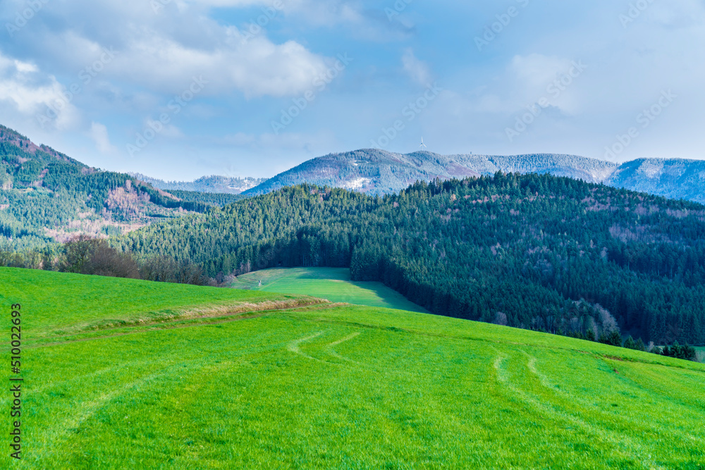 Germany, Schwarzwald nature landscape panorama view with snow covered mountain tops in springtime at sunset, a beautiful tourism destination for vacation