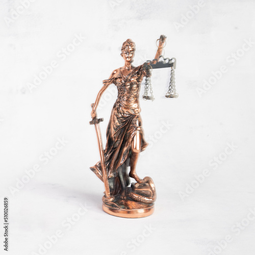 Justilia or Themis (Symbol of Justice) statue isolated on white background with clipping path.