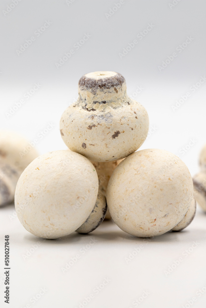 Fototapeta premium Mushroom chocolate isolated on white background. Close-up. Mushroom-shaped coated chocolate dragee