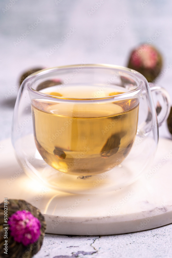 Jasmine tea balls isolated on white background. Flowering tea or blooming tea. close up Jasmine tea balls isolated on white background. Flowering tea or blooming tea. close up