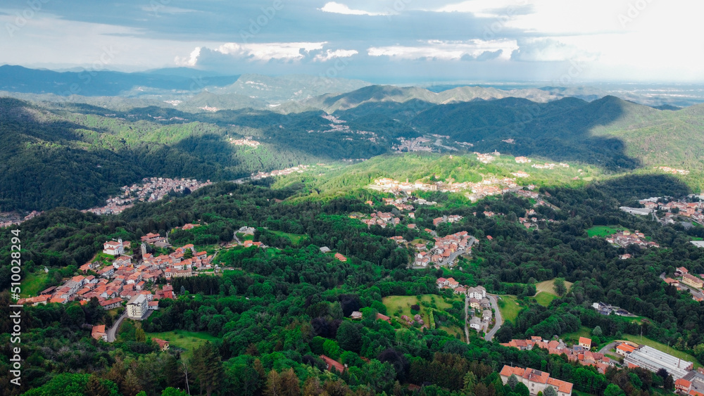 Aerial view of The Alpine foothills in Piedmont region, northwestern Italy. Green hills in the Italian Alps.