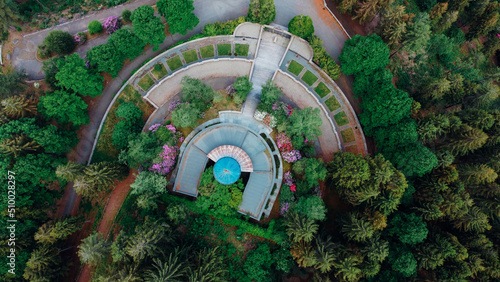 Aerial high angle view of The Monumental Cemetery of Craviolo, in the Province of Biella, Piedmont, Italy. Semicircular architecture plan. Building surrounded by nature. photo