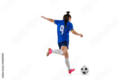 Dynamic portrait of female professional soccer, football player practicing isolated on white studio background. Sport, action, motion, fitness concept © master1305