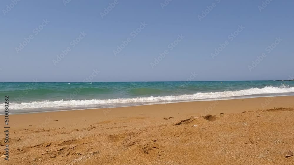 the turquoise sea spills onto the beach of Crete in slow motion the turquoise sea spills onto the beach of Crete in slow motion