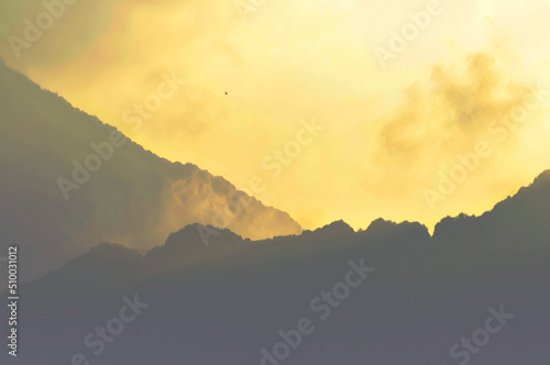 clouds over the mountains in sunset