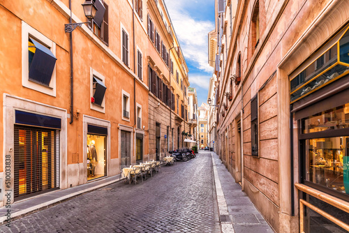 Fototapeta Naklejka Na Ścianę i Meble -  Famous Italian street with shops and restaurants, Rome