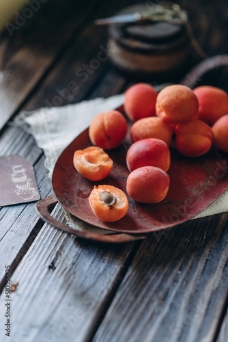 Quadro su tela food photography in low key, fruits apricots vitamins, food for vegatarin