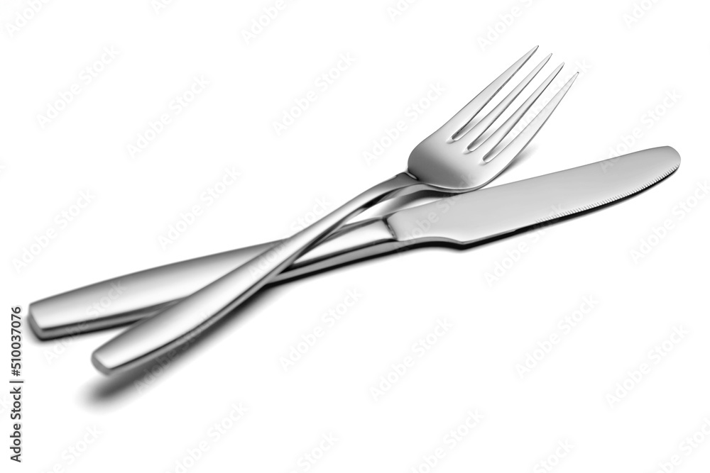 The metal shiny fork and knife on a white background. The metal shiny fork and knife on a white background.