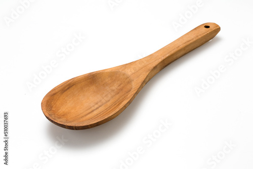 Empty wooden spoon isolated on white.