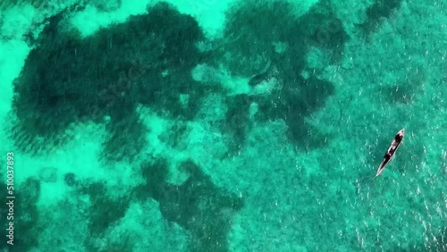 Fishing Canoe Rowing At Calm Open Sea Water, Aerial View photo