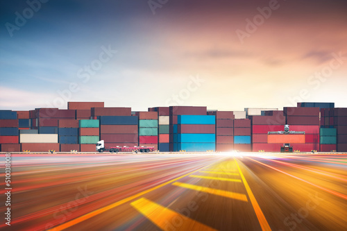 Container handler in the loading and unloading with truck at containers yard background, highway floor ground with copy space, Global Business logistic import export and cargo transportation concept