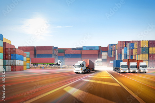 Container Truck on highway at ship port blue sky background with copy space, global business logistics import export goods of freight carrier, transportation industry concept