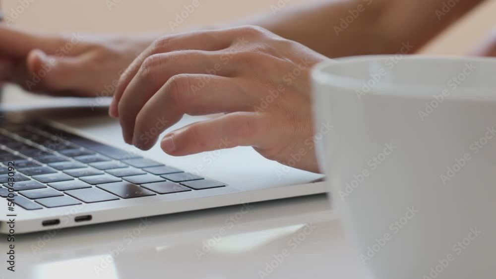 Female hands on the keyboard, the girl works at a laptop and types Female hands on the keyboard, the girl works at a laptop and types