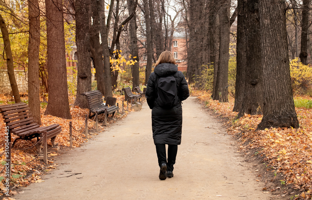 young woman in the park among yellow leaves in autumn young woman in the park among yellow leaves in autumn