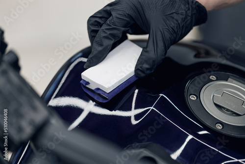 Wall Mural Applying ceramic coating on car paint with sponge applicator