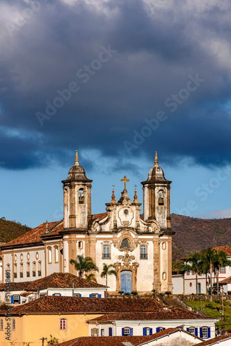 Facade of imposing and old historic church in baroque style in downtown Ouro Preto, Minas Gerais, Brazil