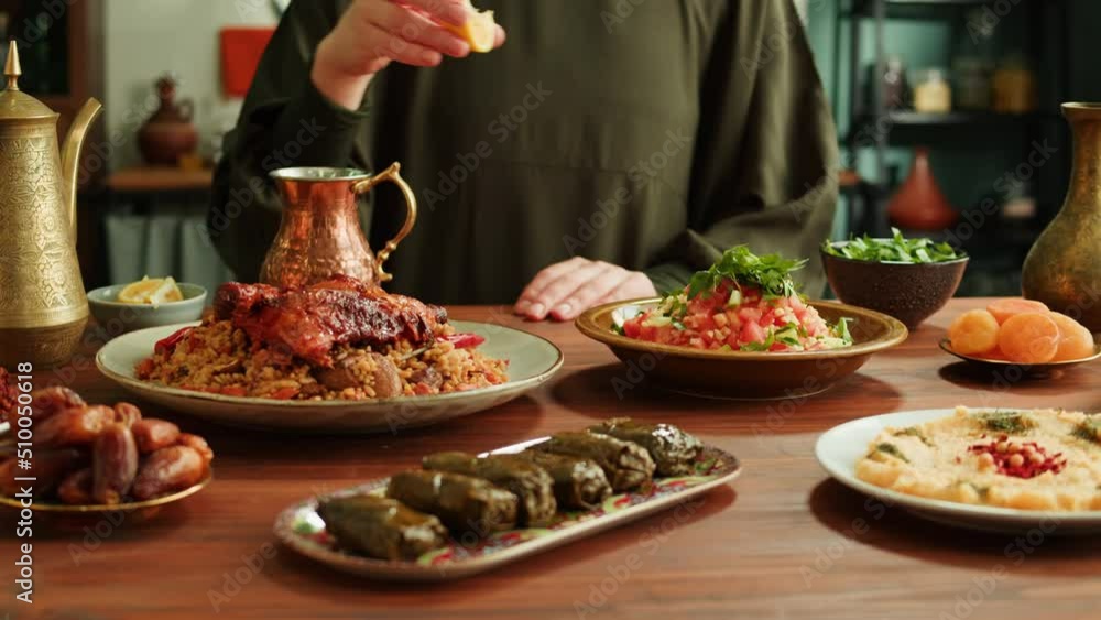 Kabsa, hummus, maqluba, maqluba, tabbouleh close-up, middle eastern national traditional food on table. Muslim family dinner, Ramadan, iftar. Arabian cuisine. Kabsa, hummus, maqluba, maqluba, tabbouleh close-up, middle eastern national traditional food on table. Muslim family dinner, Ramadan, iftar. Arabian cuisine.