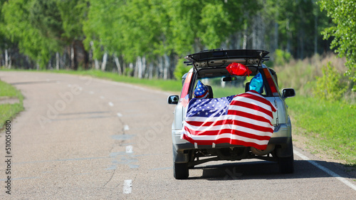 American flag on the car. Independence Day concept. USA holiday. © arsenypopel