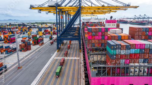 Aerial view container ship at terminal commercial seaport freight shipping maritime vessel, Global business supply chain import export logistic transportation oversea worldwide by container cargo ship