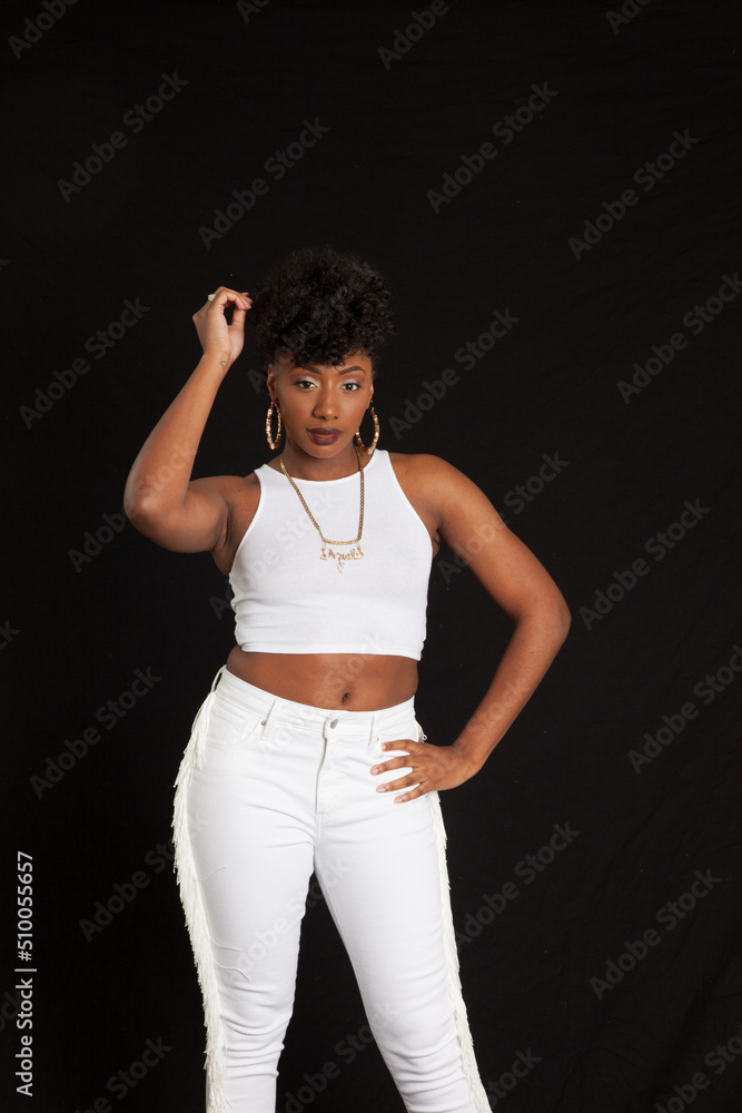 Lovely black woman in a white outfit looking pensive Lovely black woman in a white outfit looking pensive
