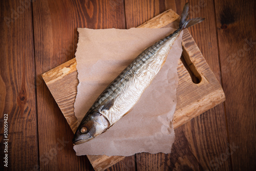 Hot smoked mackerel on the table in the kitchen. Studio photo.