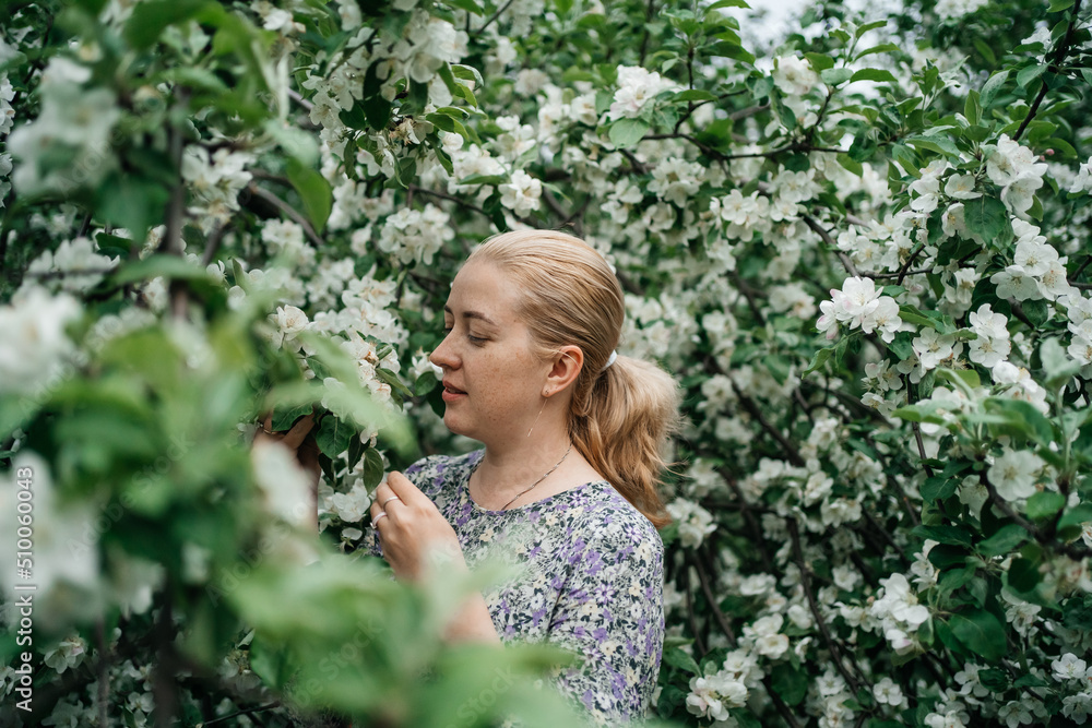 girl with blond hair in blossoming apple tree outdoor nature girl with blond hair in blossoming apple tree outdoor nature