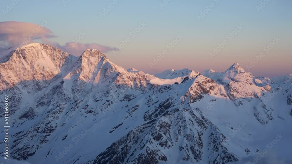 Beautiful Winter Mountain Landscape Elbrus. Adventure Hiking Trekking Ski Vacation Travel Concept. Sunset over mountain Beautiful Winter Mountain Landscape Elbrus. Adventure Hiking Trekking Ski Vacation Travel Concept. Sunset over mountain