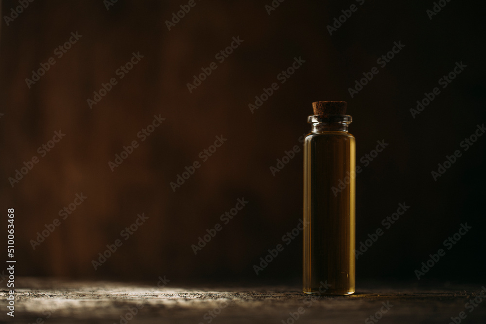 Oil bottle. Herbal. Shadow. Glass.