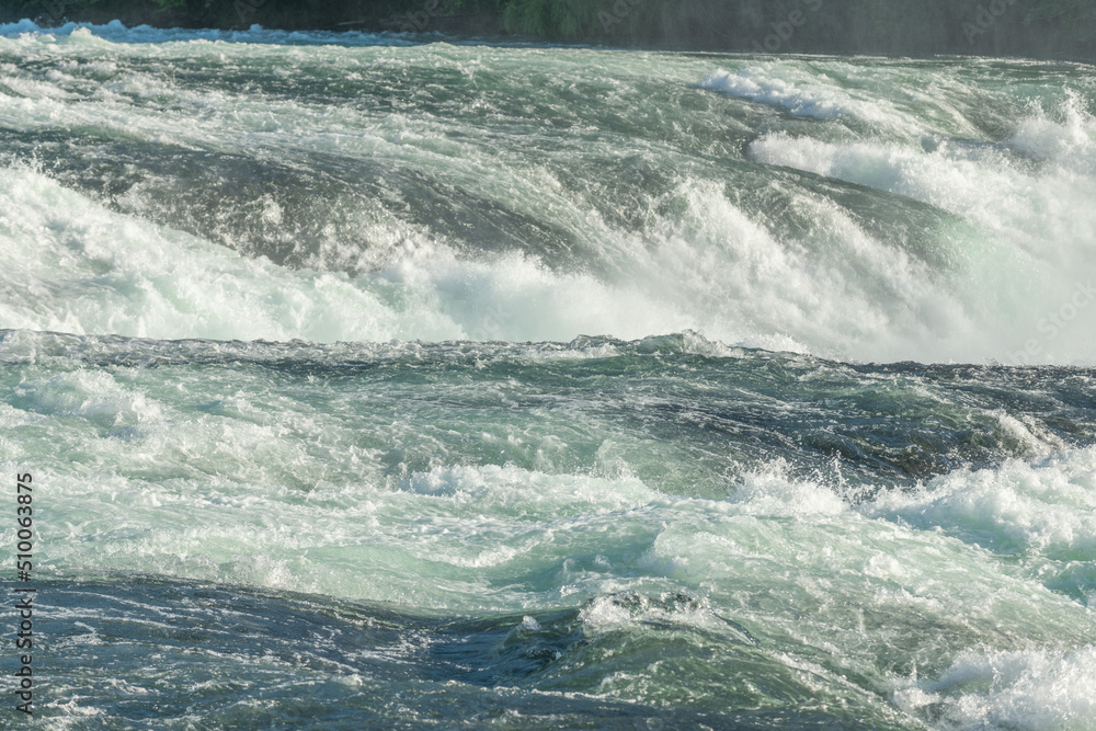 Fast currents in Rhine Falls in spring.