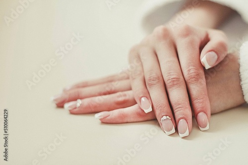 Beautiful bride s hands with a gentle nail polish