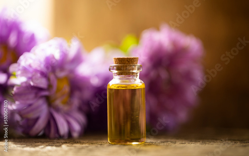 Oil bottle. Fashion photo. Spa concept. Wellness. Wooden table. Oil. 