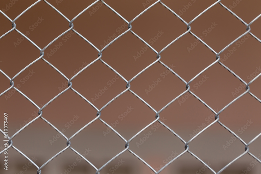 Wire mesh fence with metal grid. Wire mesh fence with metal grid.