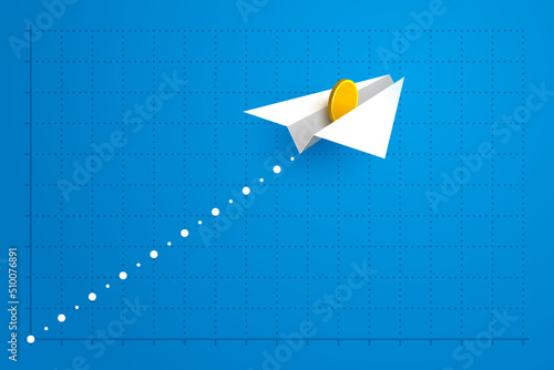 Paper airplane with gold coin is flying over grid of business graph