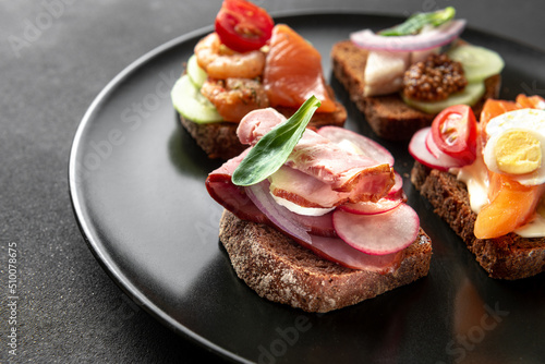 Traditional Danish cuisine. The classic dish of the open smorrebrod sandwich. photo