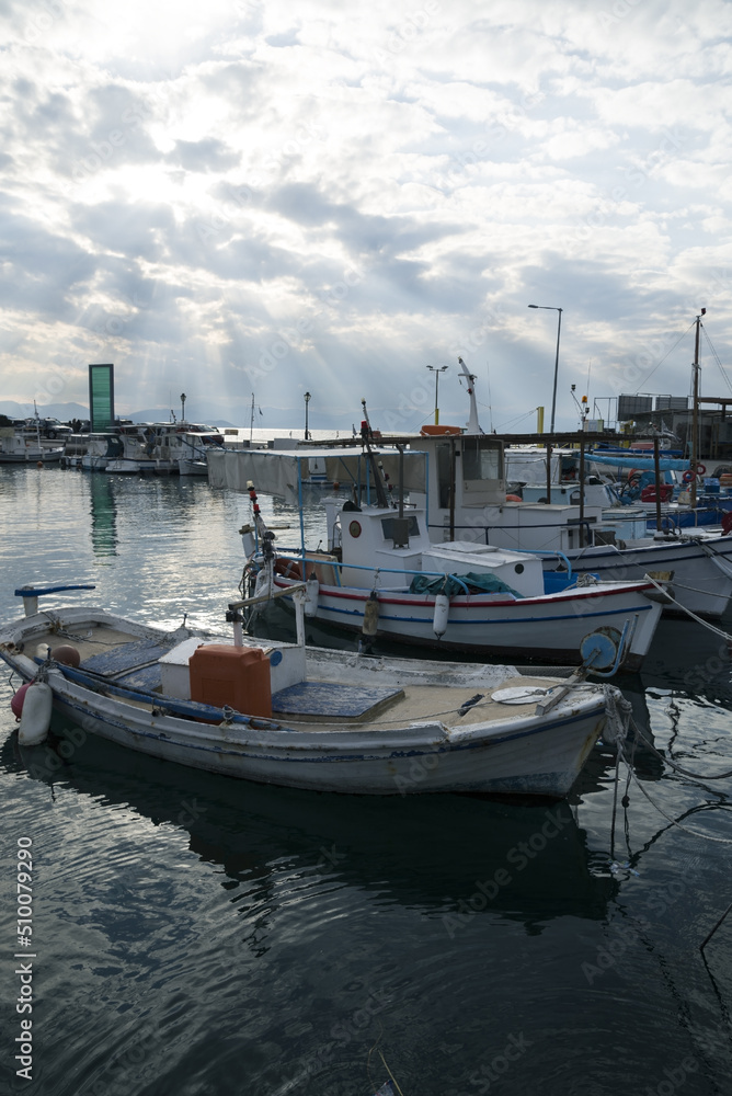 summer greek port with fishing boats and pleasure boats