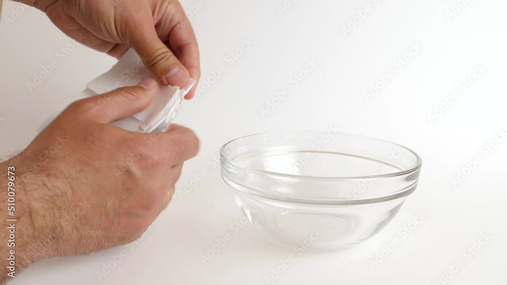 Break the bag and pour in a bowl of coffee beans. Break the bag and pour in a bowl of coffee beans.