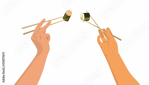 hands raised t hold in chopsticks rolls and sushi