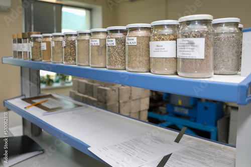 Modern laboratory for testing road samples and materials concept. Samples of bulk inert materials on laboratory shelves.