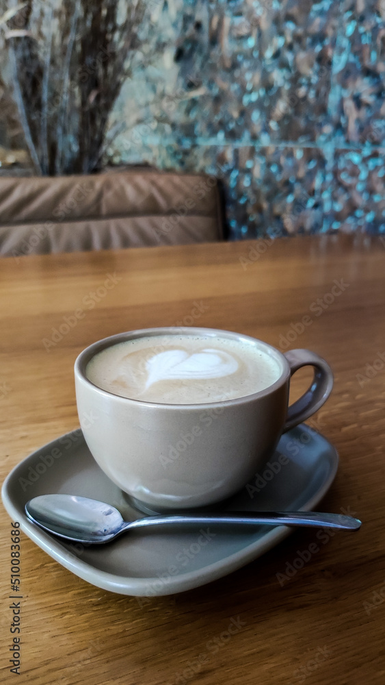 Cup of coffee on the table in the restaurant.