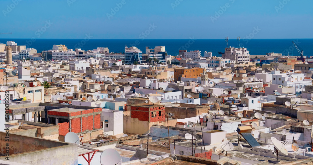 View of Tunisian cityscape of houses near to port of Sousse. Many satellite dish, antennas on private houses.