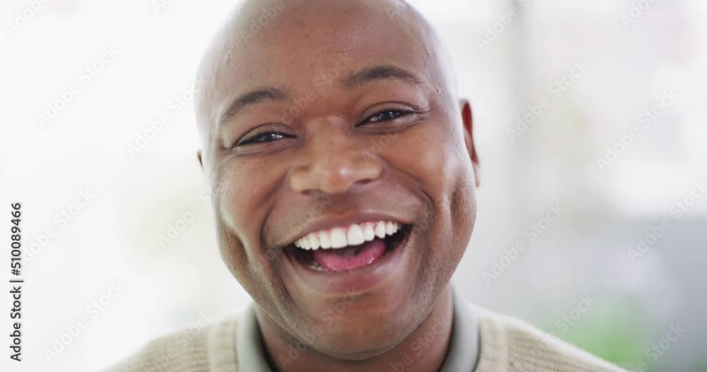 Portrait of one mature African American man with a bright smile and deep dimples looking content and attentive against bright copyspace background. Happy black man with natural white laughing Portrait of one mature African American man with a bright smile and deep dimples looking content and attentive against bright copyspace background. Happy black man with natural white laughing