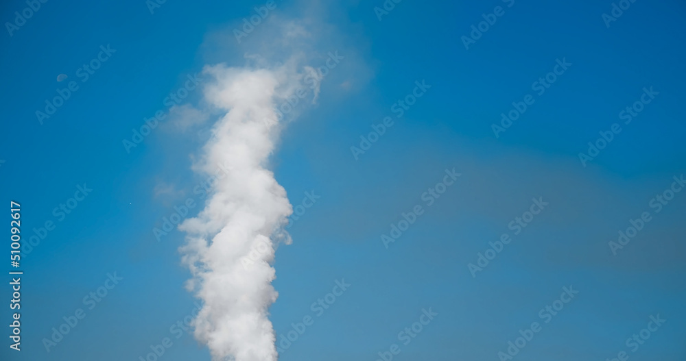 SMOKE Pollute Industry Atmosphere With Smoke Ecology pollution, Industrial Factory Pollutes. Smoke details on blue sky background.