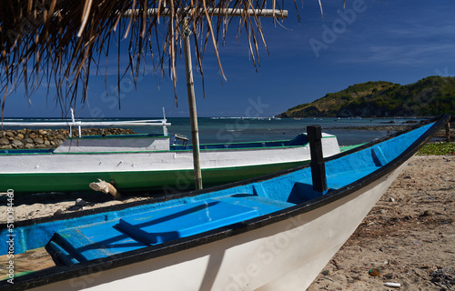 Beach with fishing boat in Asia. Sikka Regency, East Nusa Tenggara, Flores, Indonesia. photo