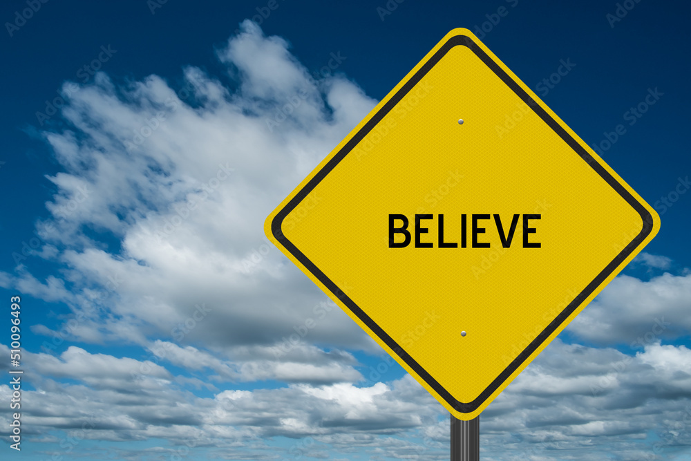 The word Believe written on a sign in nature. The word Believe written on a sign in nature.