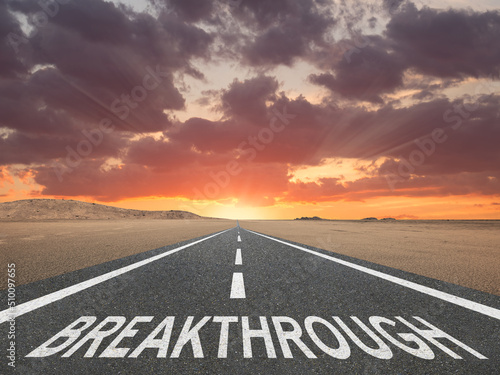 Canvas-taulu Breakthrough text on highway at sunset for new idea concept.