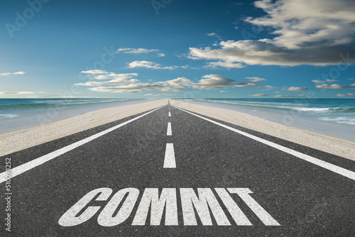 Valokuva The word Commit written on a highway for commitment and dedication concept