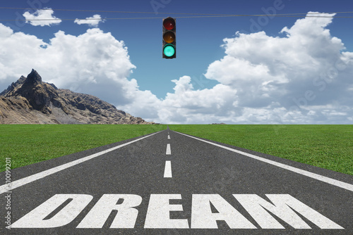 Valokuva Dream text on a highway leading to success.